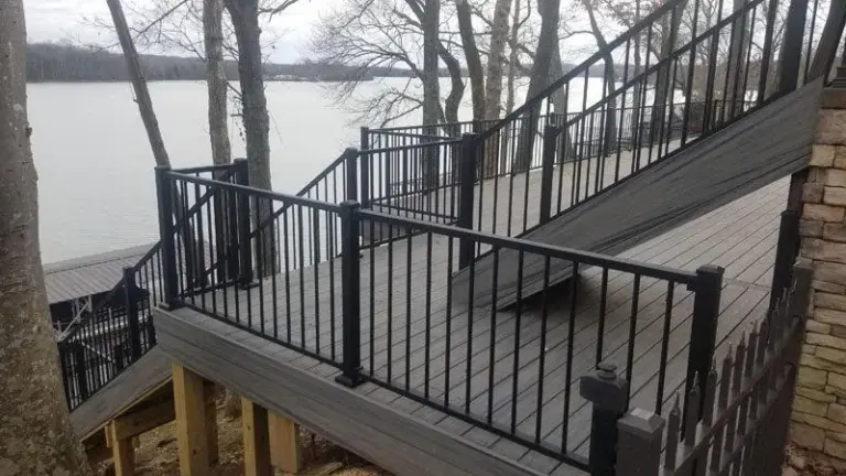 Composite deck with black railing overlooking open water